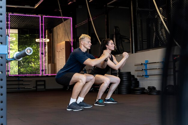 Close up on couple doing crossfit workout