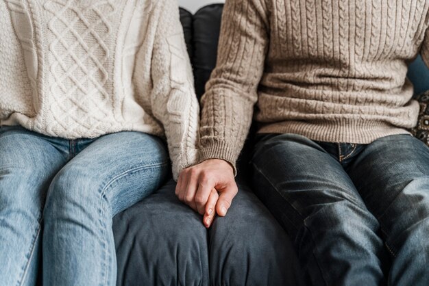 Close-up of a couple holding hands
