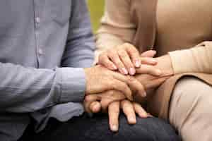 Free photo close up couple holding hands