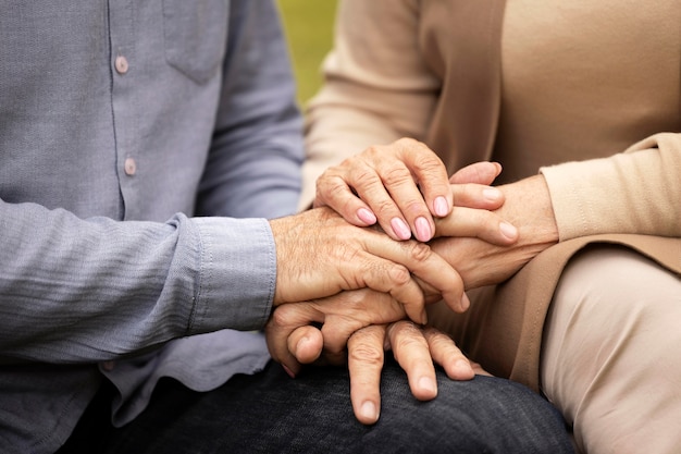 Close up couple holding hands