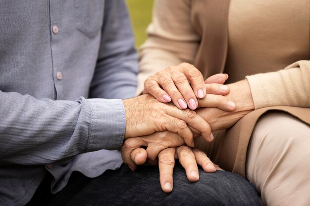 Close up couple holding hands