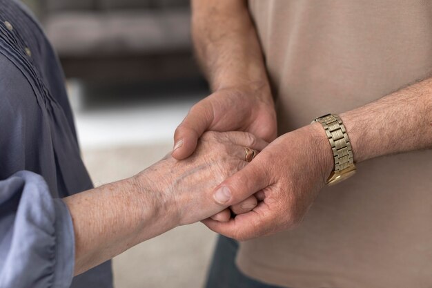 Close up couple holding hands