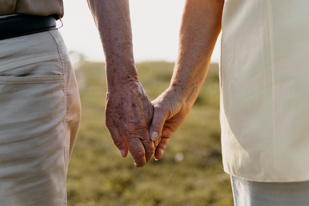 Close up couple holding hands
