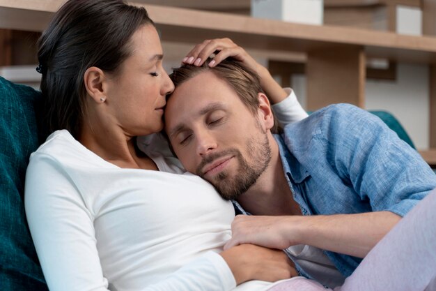 Close up on couple at home sharing tender moments