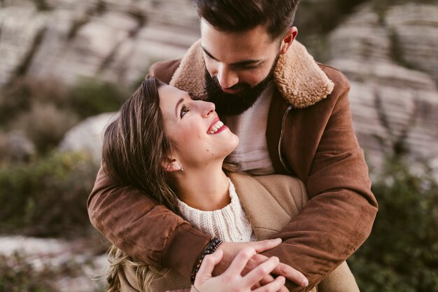 Close-up couple looking at each other in nature