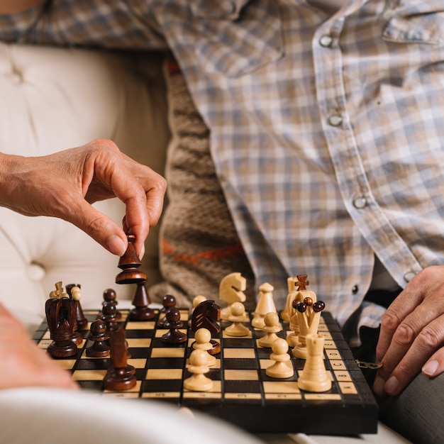 Close-up of couple playing chess