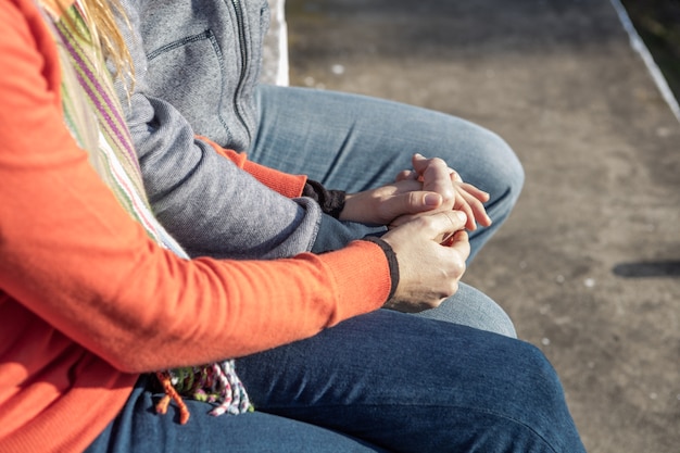 Close-up of couple playing with their hands