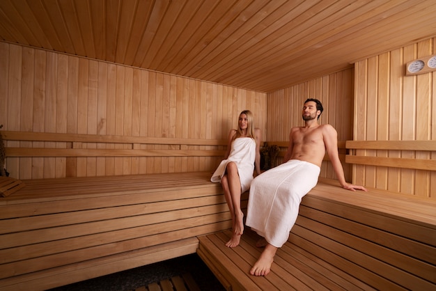 Close up on couple relaxing in the sauna