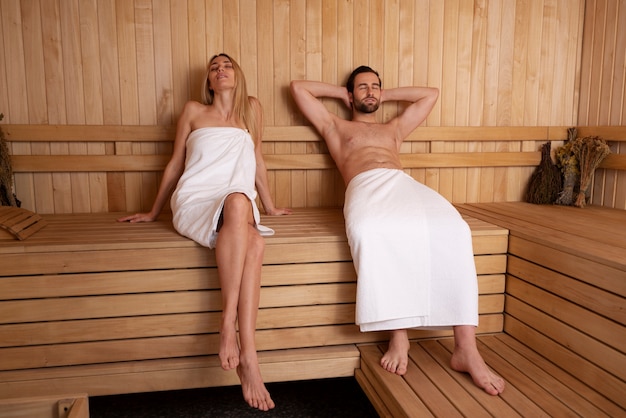 Close up on couple relaxing in the sauna