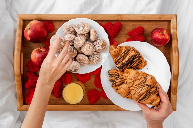 Close-up couple with breakfast in bed