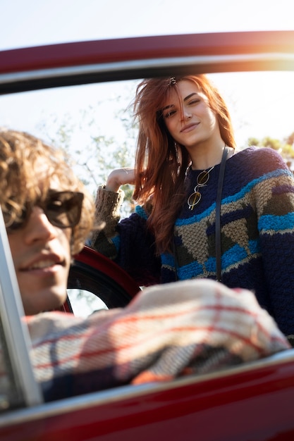 Free photo close up couple with car