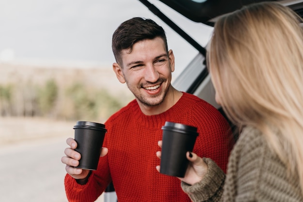 Free photo close-up couple with coffee cups