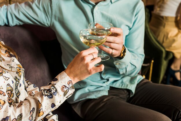 Close-up of couples toasting at party