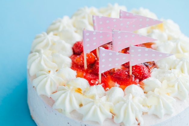 Close-up creamy cake with flags