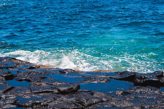 Close-up crystalline wavy water at the beach