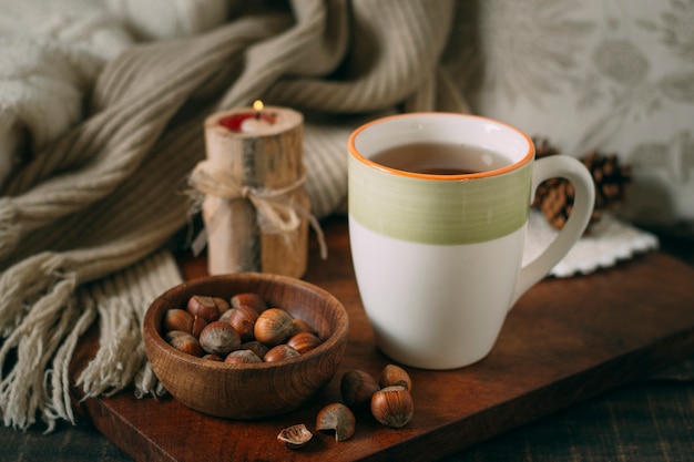 Free photo close-up cup of tea with acorns