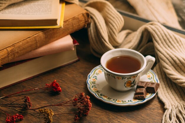 close-up cup of tea with books