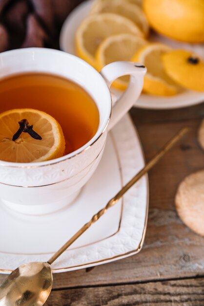 Close-up cup of tea with slices of lemon