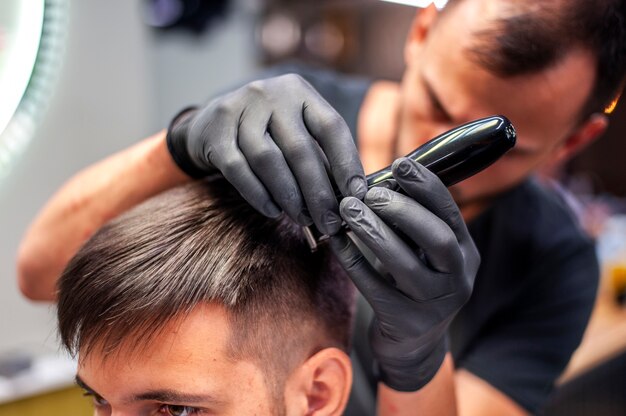 Close-up customer getting a haircut