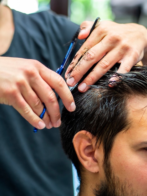 Close-up of customer getting a haircut