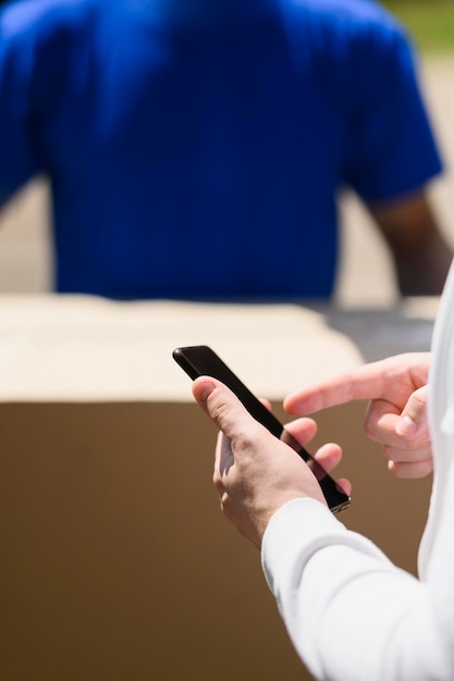 Close-up customer holding mobile phone