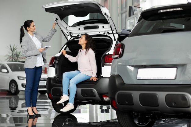 Free photo close up on customer with business person in car dealership