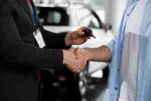 Free photo close up on customer with business person in car dealership