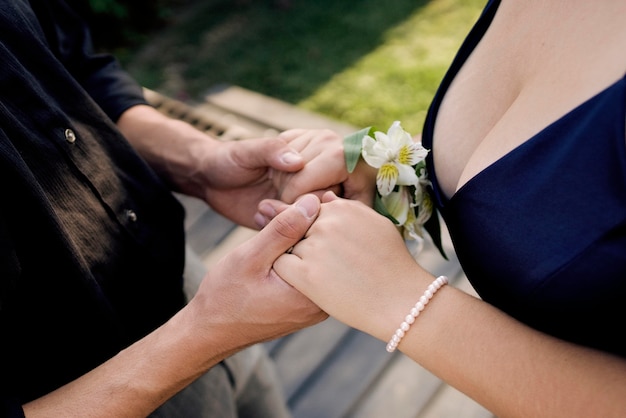 Close up cute couple holding hands