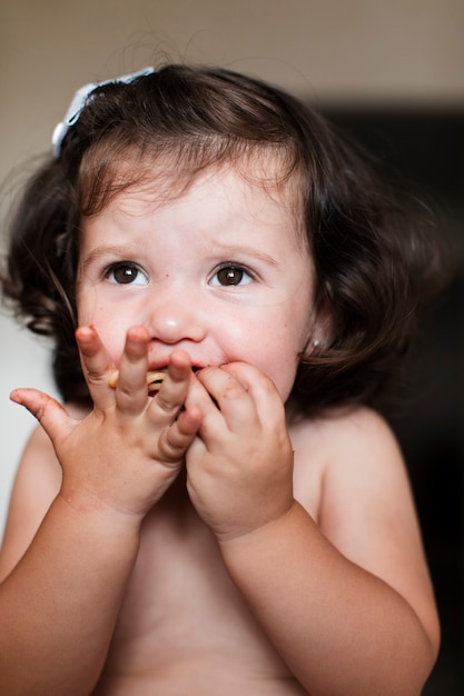 Close-up cute girl eating 