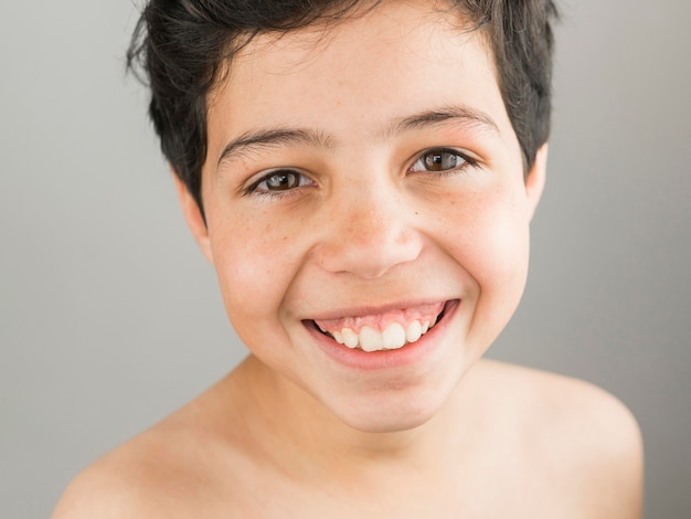 Close-up cute happy boy smiling