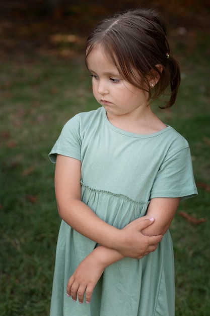 Free photo close up on cute and sad little girl