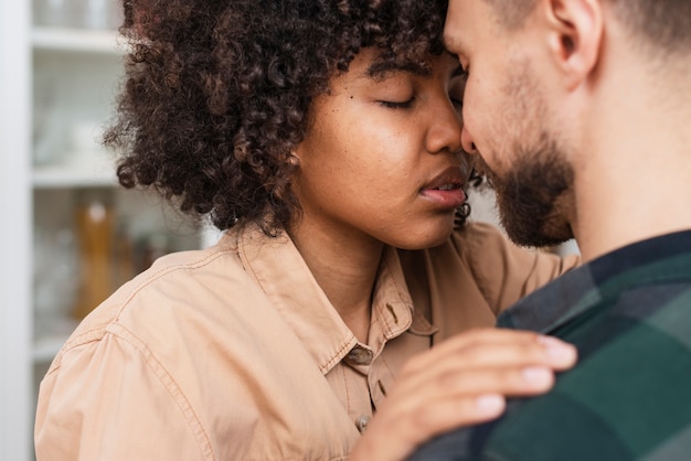 Close-up cute young couple embracing