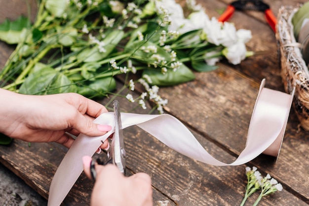 Close up cutting ribbon on the table 