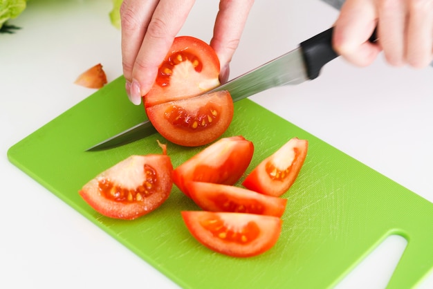 Close-up cutting tomatoes