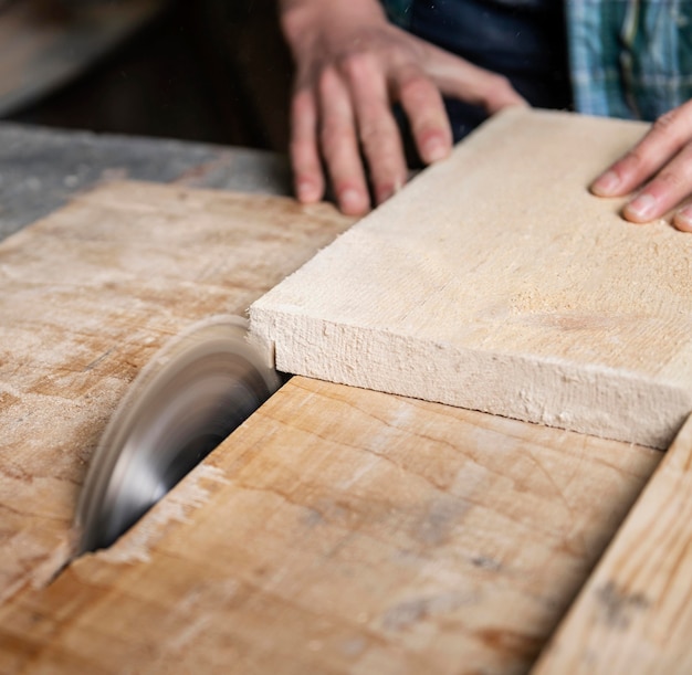 Close up cutting wood planks