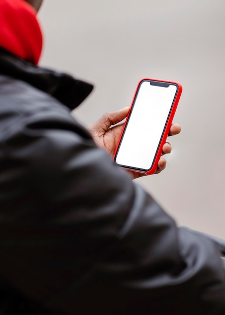 Close-up cyclist using his mobile phone