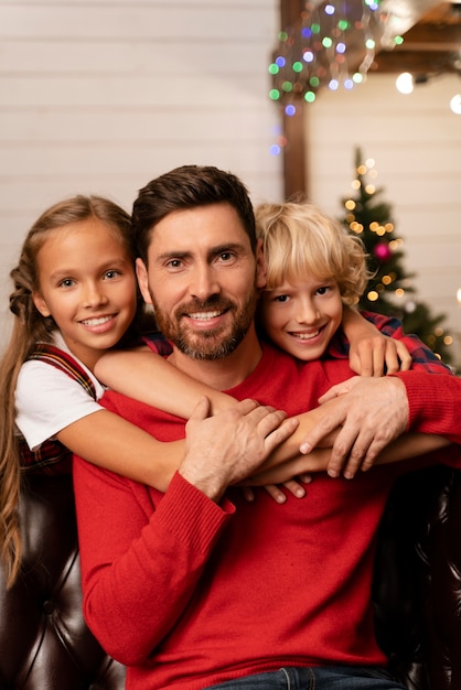 Free photo close up on dad and kids opening gifts