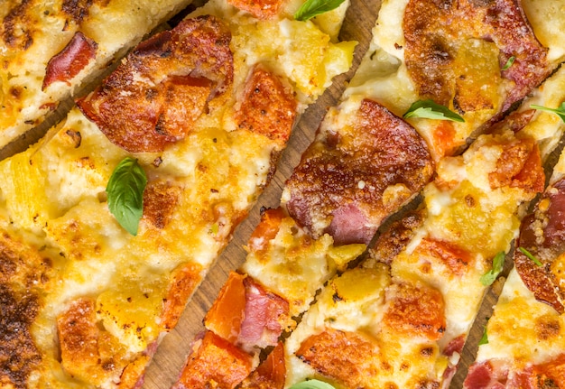 Close-up of delicious baked pineapple and papaya pizza