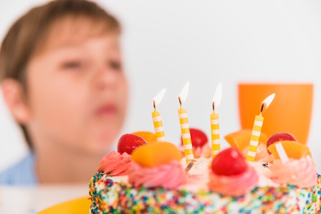 Close-up of a delicious birthday cake with burning candles