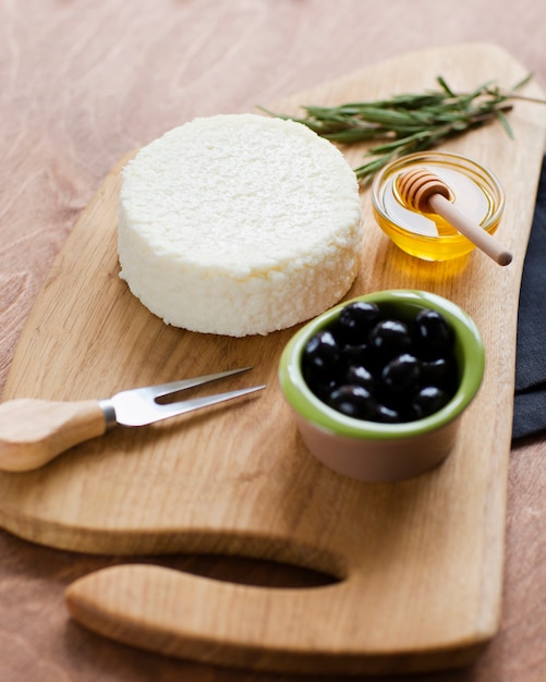 Close-up delicious cheese with olives