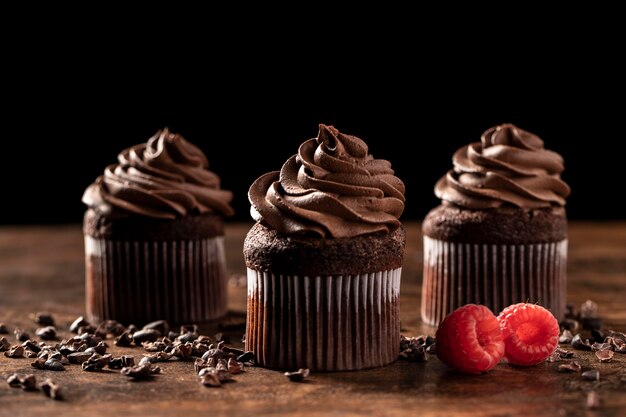 Close-up of delicious chocolate cupcakes with raspberry