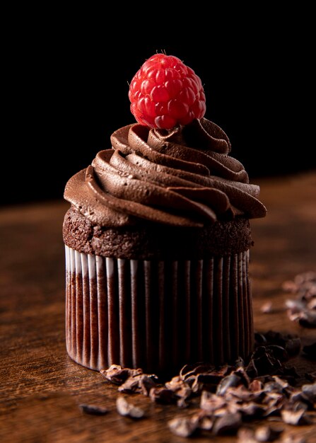 Close-up of delicious chocolate cupcakes with raspberry