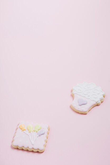 Close-up of delicious cookies on pink background