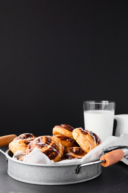 Close-up delicious pain aux raisin and milk