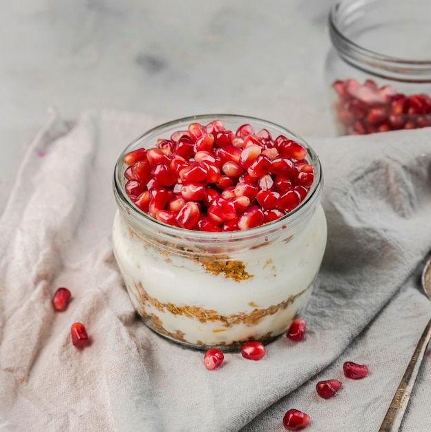 Free photo close-up delicious yogurt with pomegranate seeds