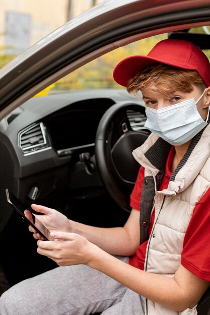 Close-up delivery guy in car