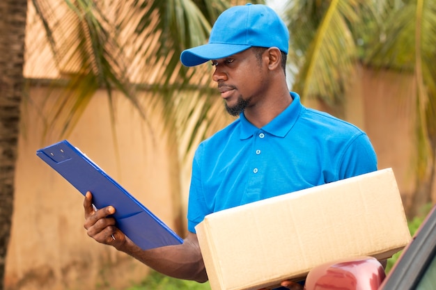 Close up on delivery person with parcel