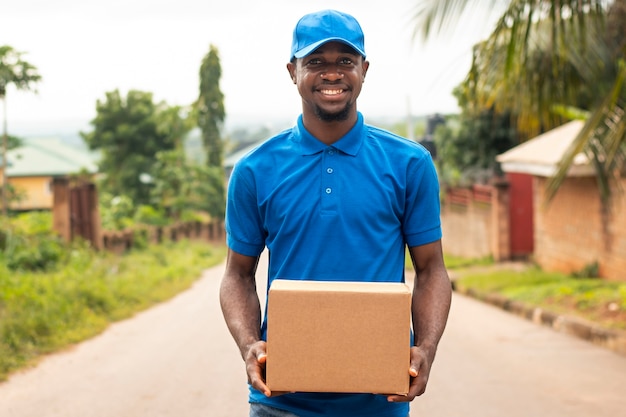 Close up on delivery person with parcel