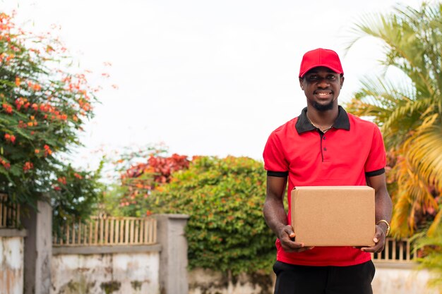 Close up on delivery person with parcel