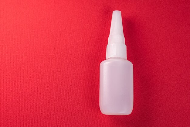 Close up details of a glue bottle isolated